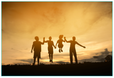 Family playing at sunset